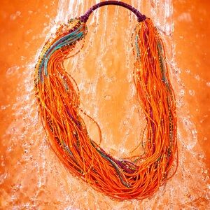 Strands of Orange and Other Bright Colored Beaded Necklace